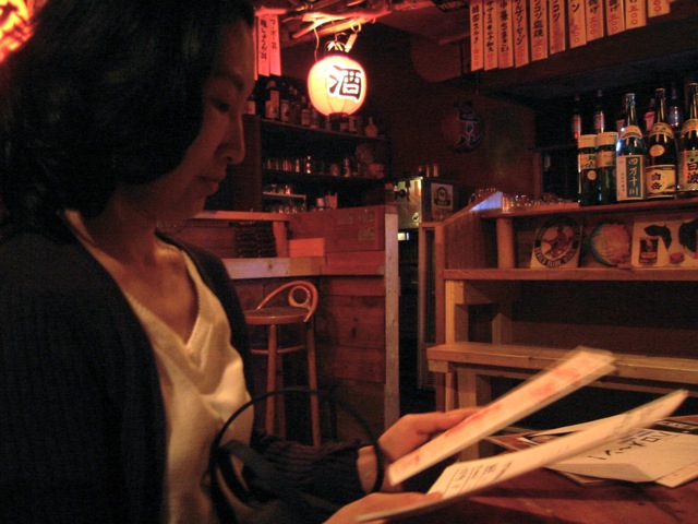 mari-negaposi Mari reads flyers at Negaposi.