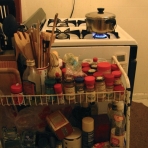 Seasoning rack shared by four housemates.