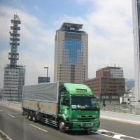 View from the bus window. Passing through Kobe(?) as we ride south. We were two of four passengers on the bus.